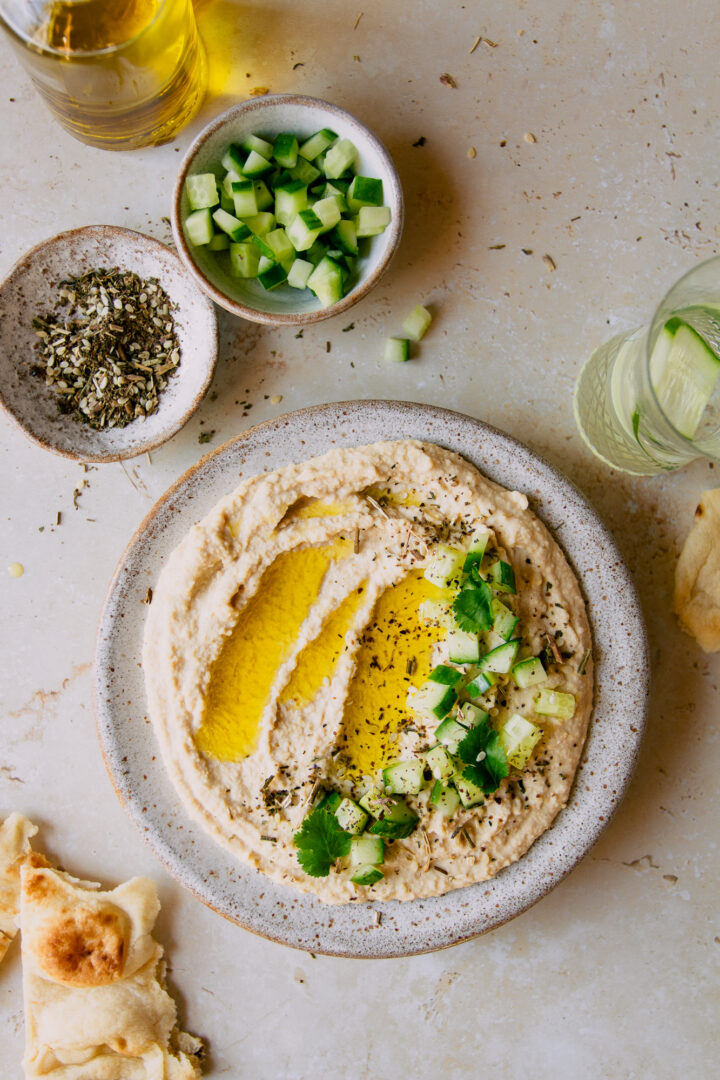 Creamy hummus with cucumber and za'atar